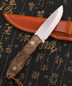 A bushcraft wooden handle knife, displayed against its leather knife sheath.