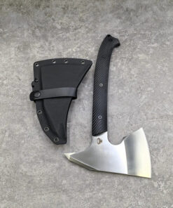 A fighting axe tomahawk, displayed next to its Kydex scabbard.