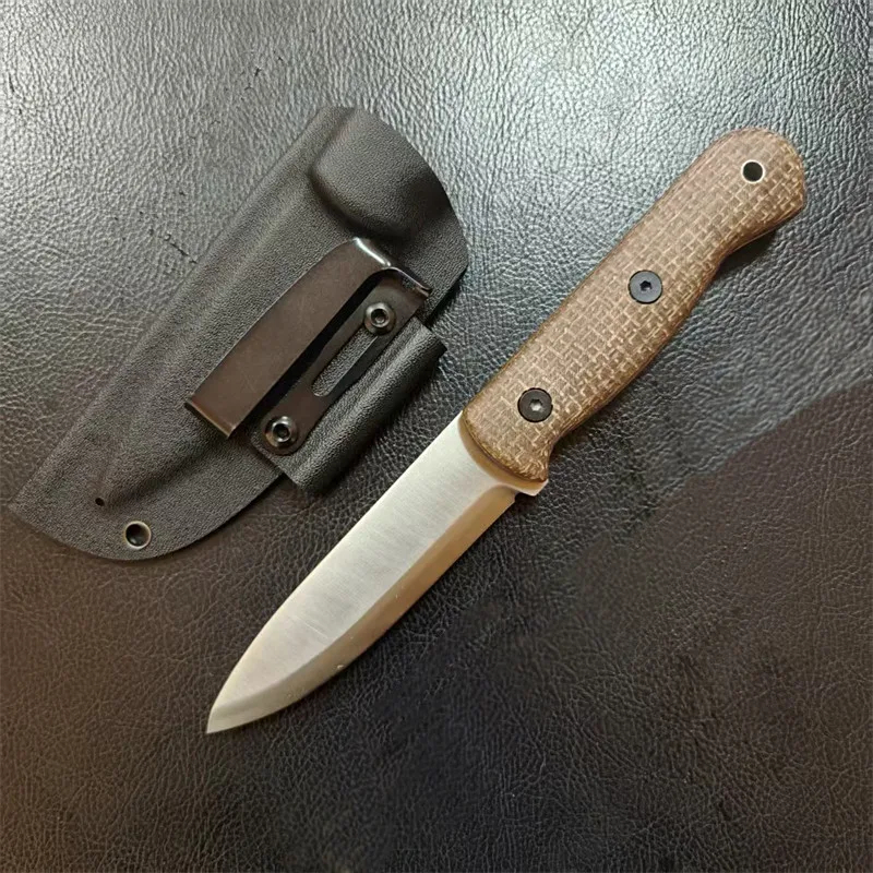 Full Tang Knife A bushcraft full tang knife displayed next to its sheath.
