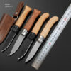 Four pocket knife with wooden handle models displayed next to a steel ruler.