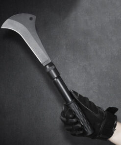 A man's hand holding a survival bill hook machete.
