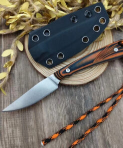A small, fixed blade bird knife displayed next to its sheath.