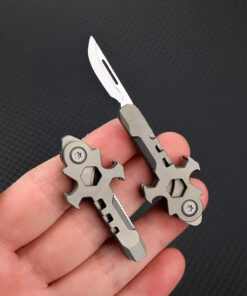 A man's hand holding a mini keyring knife multi tool.