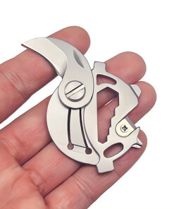 A multi tool keychain knife displayed on a man's fingertips.