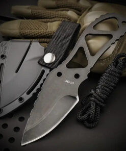 A mini knife necklace, displayed next to its small sheath.