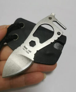 A man's hand holding a small neck knife and its mini sheath.