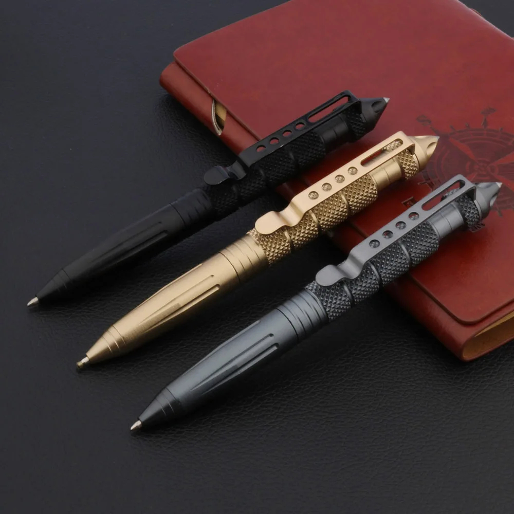 Tactical Pen Self Defense Three tactical pen self defense models of differing colors displayed leaning against a leather wallet.