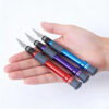 A mans's hand hold three craft knife models of differfing colors.