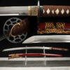 A Kobuse Laminate metal Katana sword, displayed on a small stand alongside its scabbard.