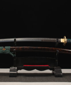 A true dragon sword Katana, displayed on a wooden stand alongside its scabbard.